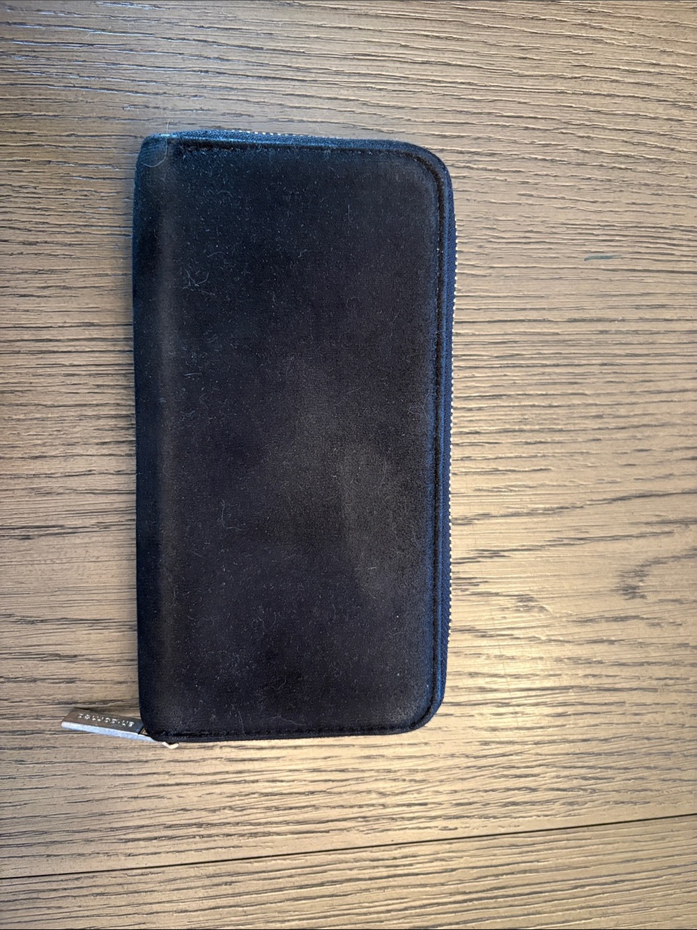 Sleek Black Zip-Around Wallet with Wrist Zip Pull